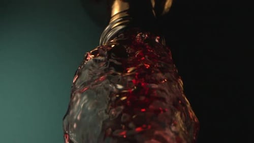Bottle With Wine Pouring Down On A Green Background