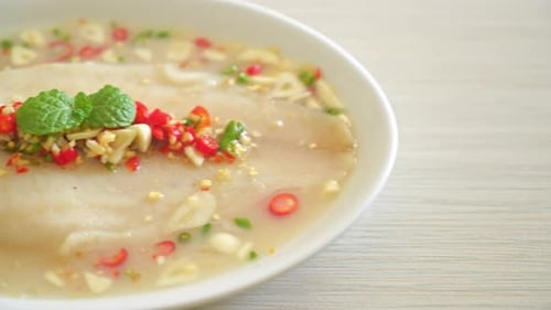 Plate of Steamed Fish with a Spicy Sauce