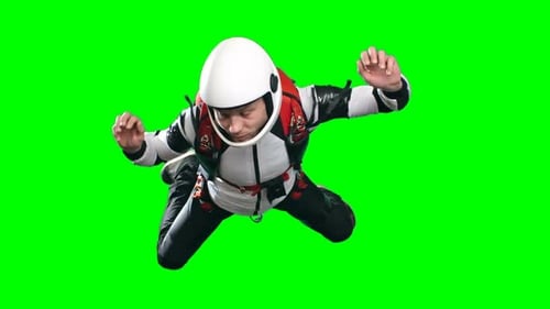 Skydiver Floating Against a Green Screen Background
