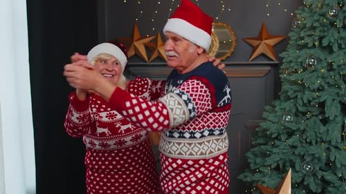 Senior Couple Dancing Merrily at Christmas Time