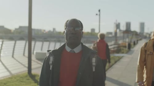 African American Businessman Walking in City in Morning