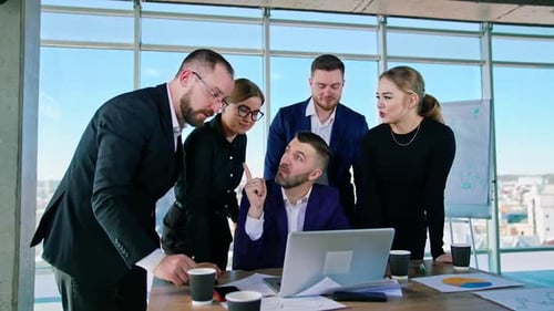 Business executives interacting with each other in conference room at office