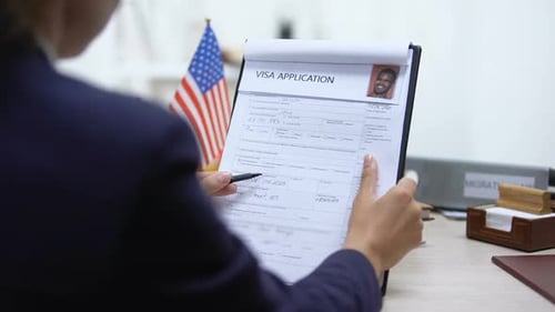 Visa Application Approved in Office with US Flag