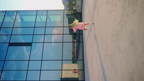 Girl dancing outdoors. Back view. Young professional dancer improvise in freestyle