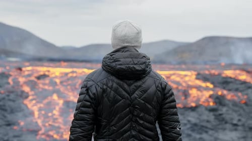 Young Adult Observing a Lava Field