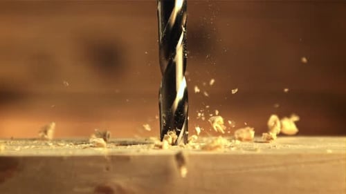 Drill Boring Into Wood Creating Shavings