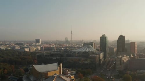 AERIAL: View of Berlin, Germany Alexanderplatz TV Tower with Beautiful Orange Autumn Sunlight Haze