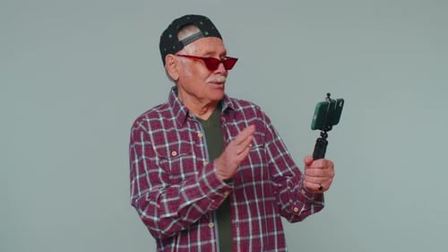 Man Blogger Take Selfie on Mobile Phone Selfie Stick Communicate Video Call Online with Subscribers