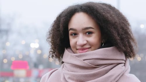 Portrait of Afro American Authentic Girl Teenager Darkskinned Girl with Curly Hair Wears Warm Winter