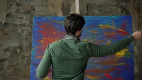 Artist Painting an Abstract Design on Canvas