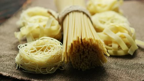 Assorted Pasta Noodles on Burlap in Close-Up