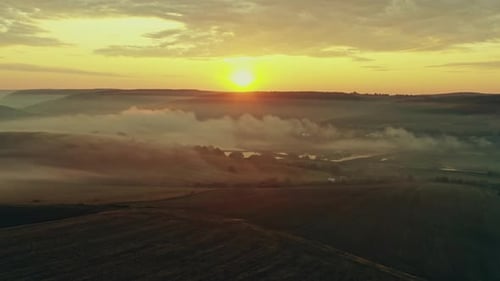 Sunrise Over Foggy Golden Rural Landscape