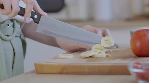 Woman Slicing Banana