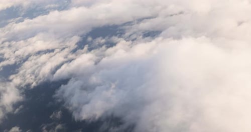 Beautiful Aerial View Of Clear Sky Over White Fluffy Clouds From Height Flight Of Plane