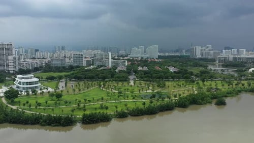 rising crane drone shot of ultra modern lake shore residential development area with beautiful circu