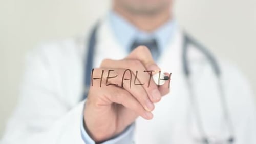 Doctor Writing 'Health' on a Clear Surface