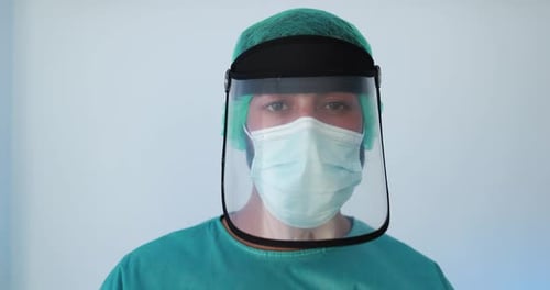 Young man doctor at work inside hospital during coronavirus outbreak