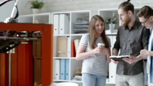 Group of Engineers Working with Tablet in 3D Printing Studio