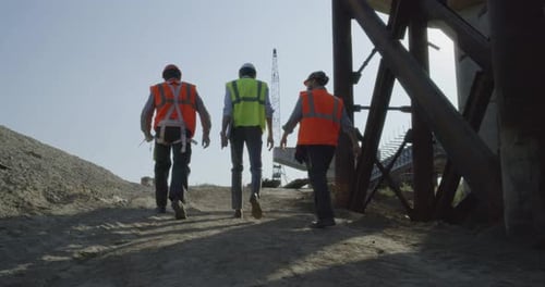 Inspectors Walking on Bridge Construction Site