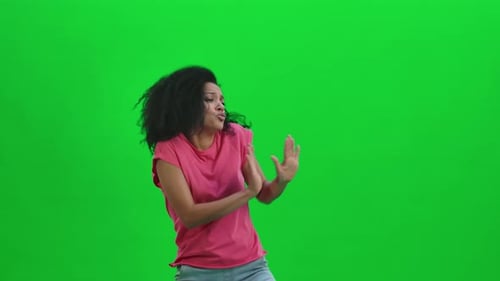 Woman Dancing Happily Against Green Screen