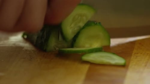 Cucumber Slicing on Cutting Board Close-up