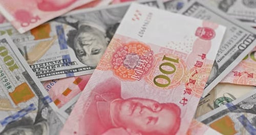 Close-up of US Dollars and Chinese Yuan Currency