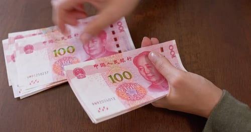 Counting Chinese Yuan Renminbi Banknotes