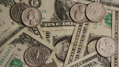 United States Currency with Coins and Dollar Bills