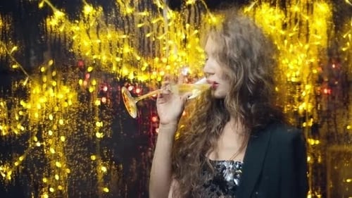 Glamorous Woman Celebrates with Champagne in Night Setting
