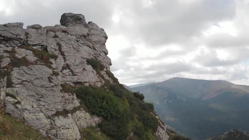 Majestic Landscape with Rocky Mountains and Grassy Valleys