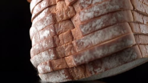 Sliced Rye Bread Falling in Slow Motion