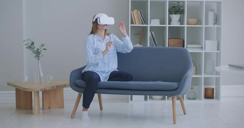 Woman in VR Headset Interacting with Digital World