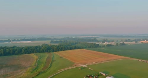 Landscape After Rain with a Light Haze Sunrise Dawn a Field with Green Grass Summer Near Road