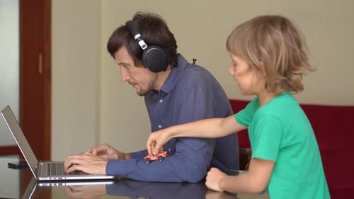 During Quarantine Man Is Trying To Work Remotely From Home, but His Son Disturbes Him
