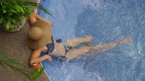 Overhead shot of woman in hot tub. Shot on RED EPIC for high quality 4K, UHD, Ultra HD resolution.