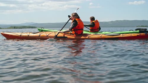 Couple Paddling in Lake