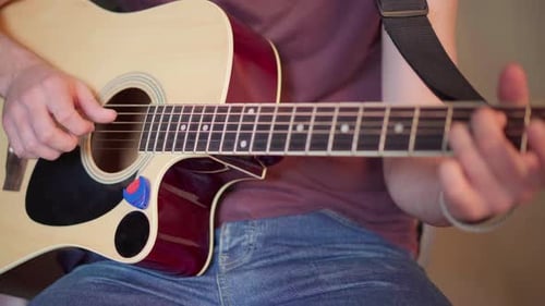 Handsome Young Man Playing Acoustic Guitar Sitting Chair Close Up Shoot