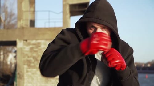 Young Adult Practicing Boxing Punches, Close Up