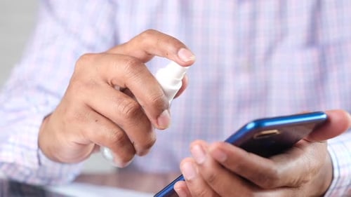 Disinfecting a Mobile Phone with Spray