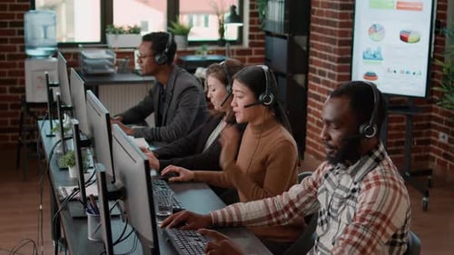 Diverse Team of People Talking to Clients on Phone Helpline