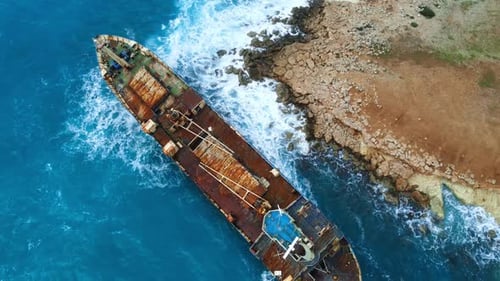 Wreck Sunken Ship in the Sea or Ocean Environmental Disaster Old Rusty Ship in Shallow Water Aerial