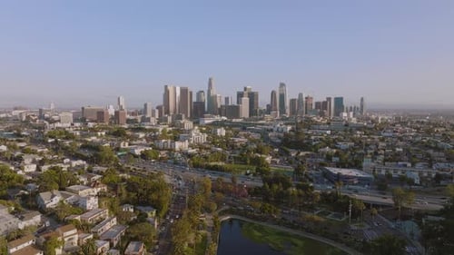 Flying Over Los Angeles, Drone Shot of Downtown Skyline Ahead and Busy Freeways Below