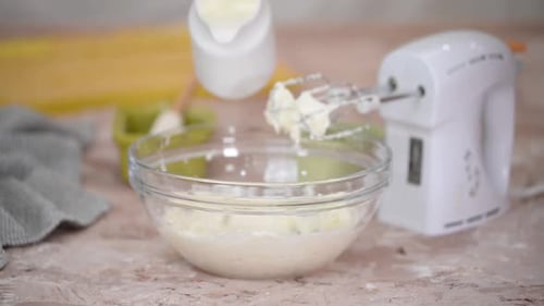 Young Hous Wife Mixing Wiped Cream