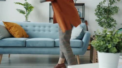 Woman Dancing at Home with Headphones