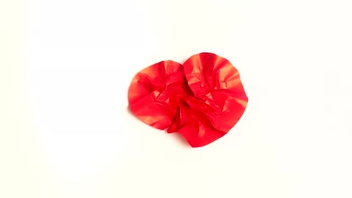 Red Paper Heart Beat on white background Crumple and Uncrumple Stop Motion Animation