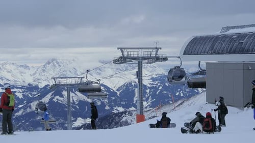Chairlifts and gondola lifts arriving in the station