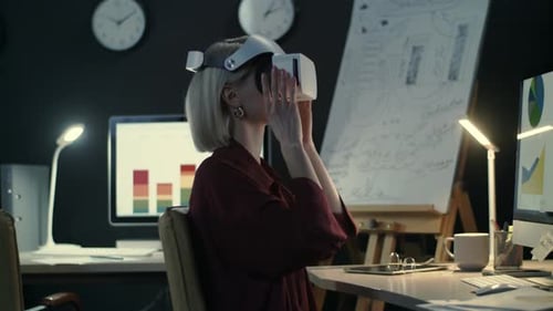 Modern Business Woman Wearing Virtual Reality Glasses in Night Office