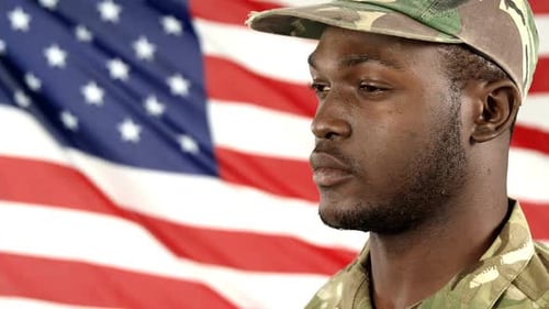 Man Saluting in Front of American Flag