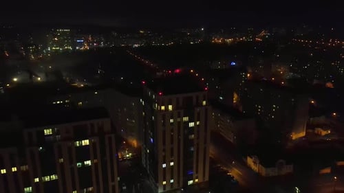 Flight Over the Night City and the House That Glows at Night