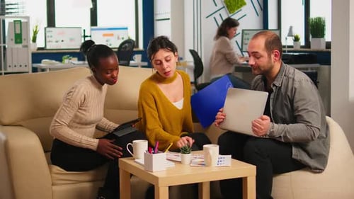 Diverse Team Brainstorming in Modern Office